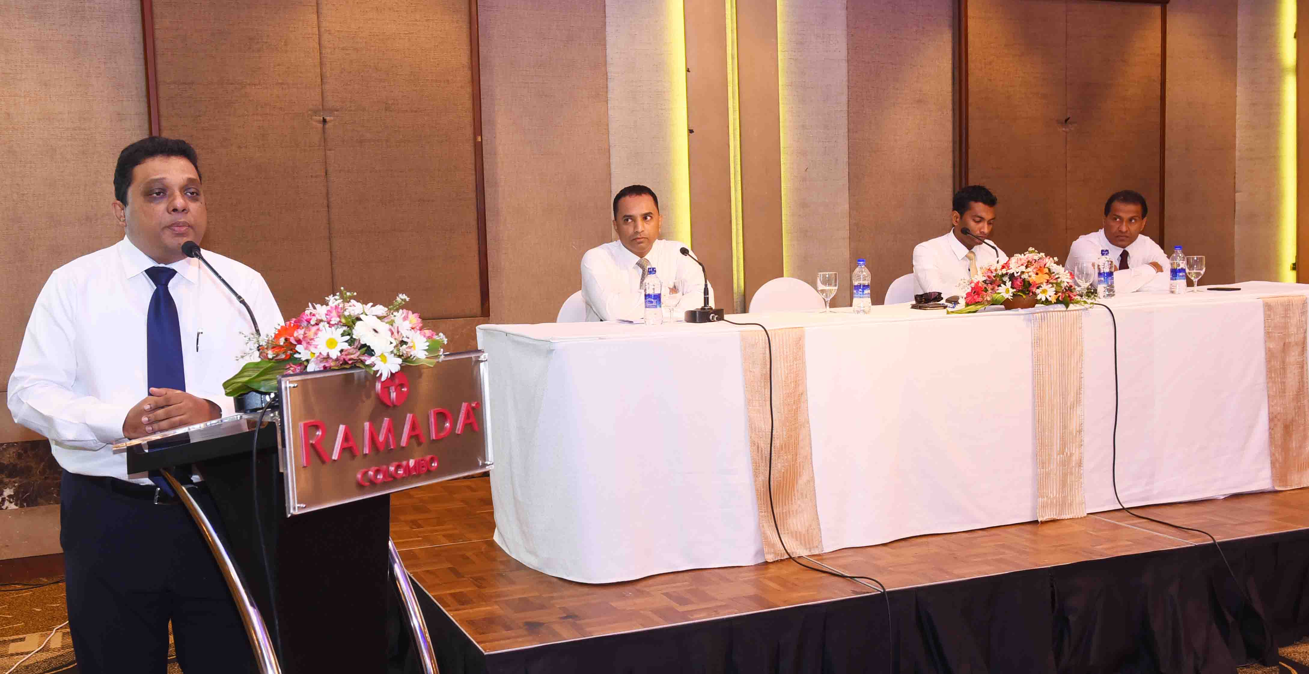 SriLankan Airlines Sales Manager Sri Lanka and Maldives Jayantha Abeysinghe addressing the gathering whilst officials of the SriLankan Sales Team looks on.