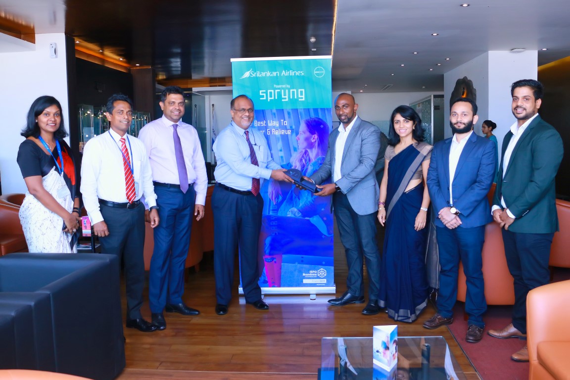 SriLankan Airlines Acting Chief Officer Service Delivery Capt. Rajind Ranathunga(center left) receiving “Spryng” units