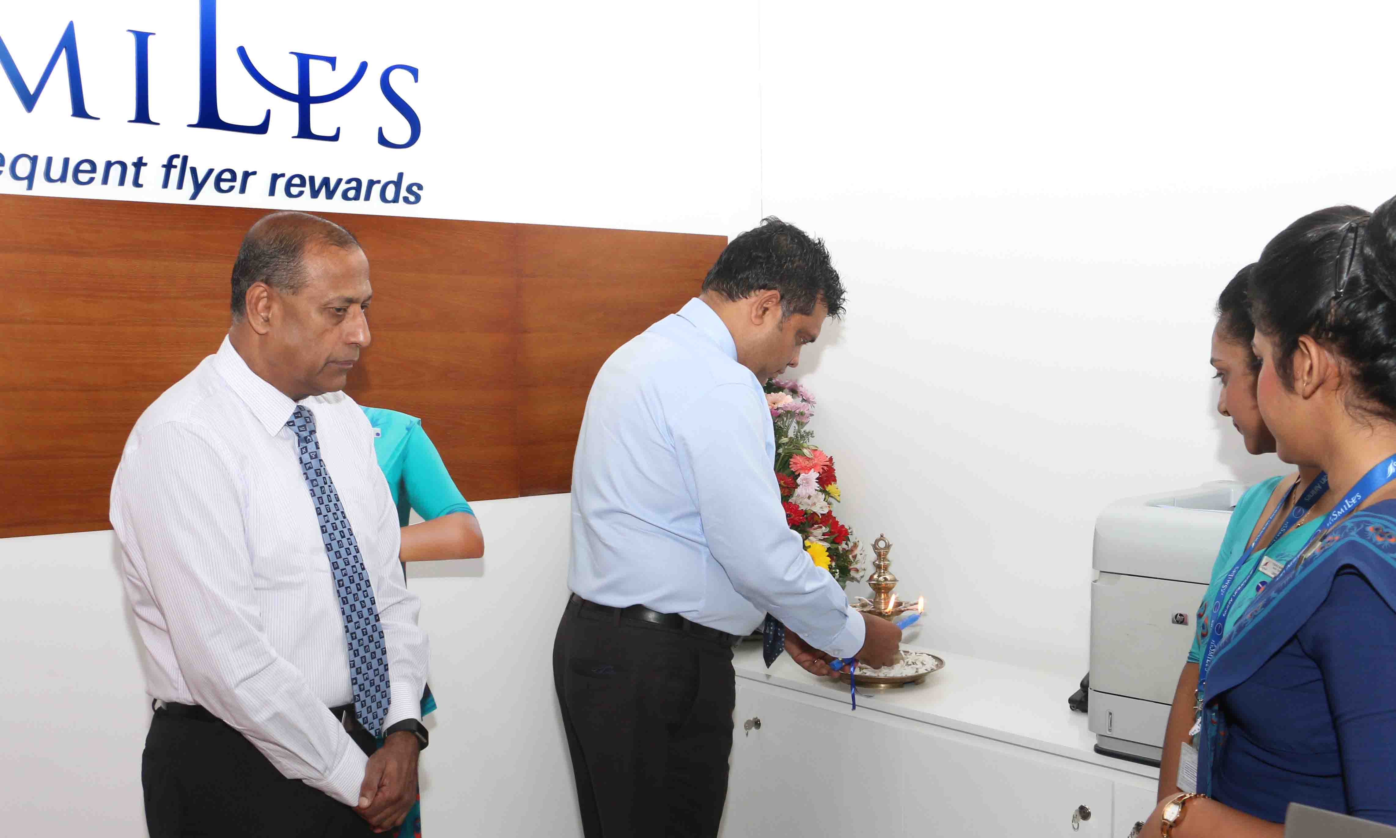 SriLankan Airlines Head of Worldwide Sales & Distribution Dimuthu Tennakoon lighting the oil lamp at the opening ceremony, whilst SriLankan Airlines Chief Commercial Officer Siva Ramachandran (left) looks on