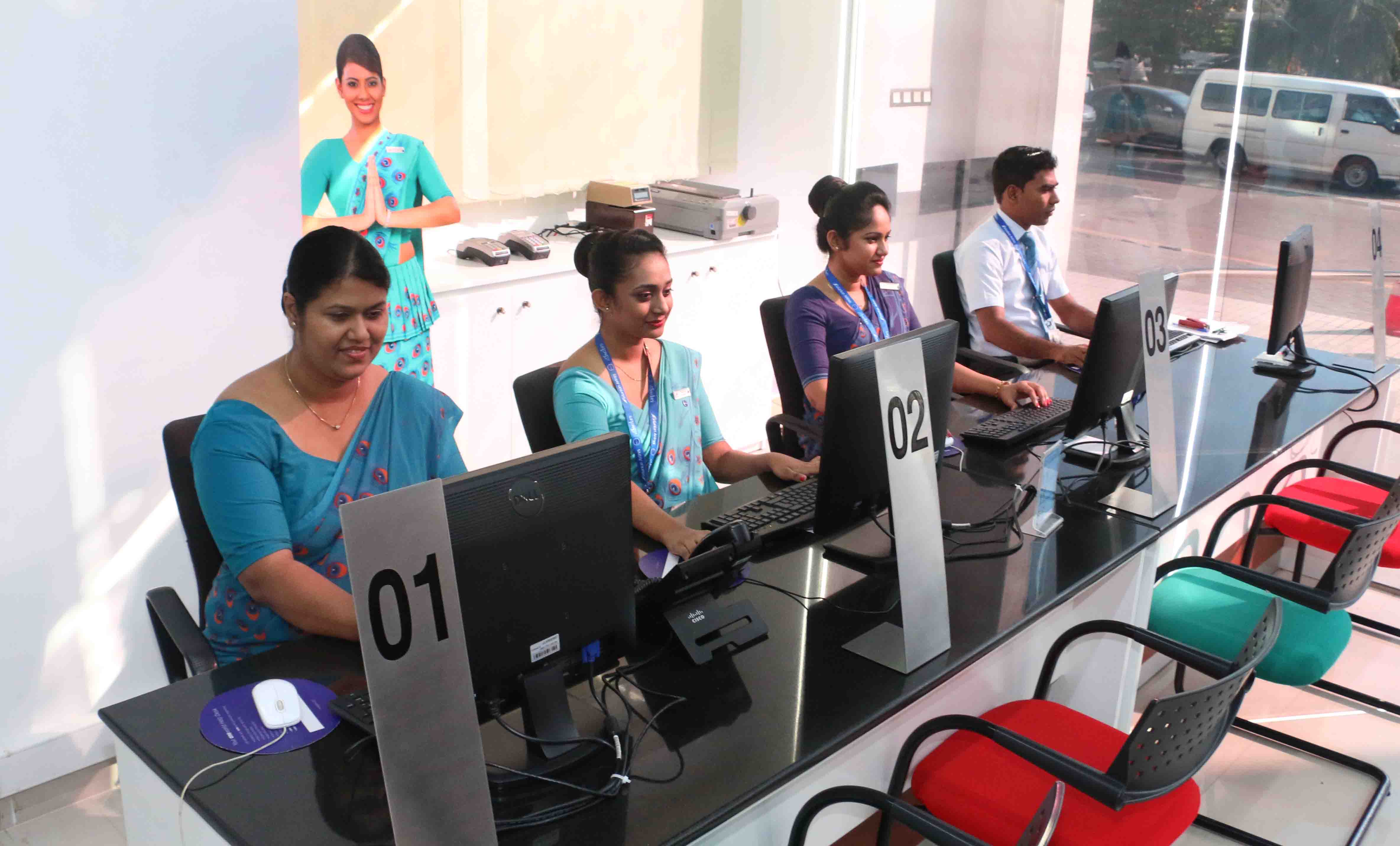 Staff members at the newly open FlySmiLes service Centre